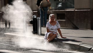 Tourist in New York sets Monday near hot vapor on one of the hottest days of the year. New York was under emergency situations